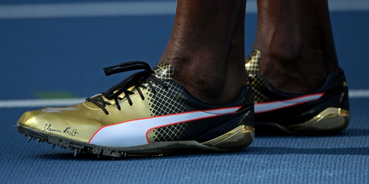Usain Bolt s Gold Puma Spikes